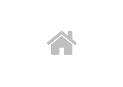 A simple gray house icon with a chimney is centered on a white background.